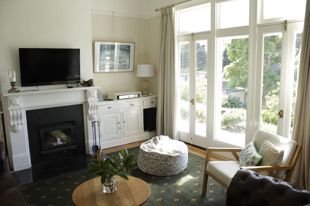 Front lounge with marble fireplace and woodfire.