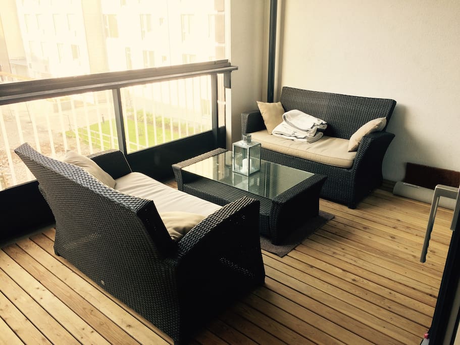 The balcony suits as a nice place for relaxation or dining.