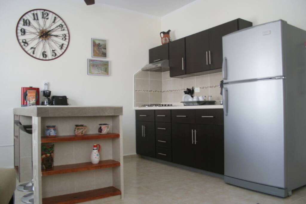 kitchen with coffee makers, toaster, microwawe