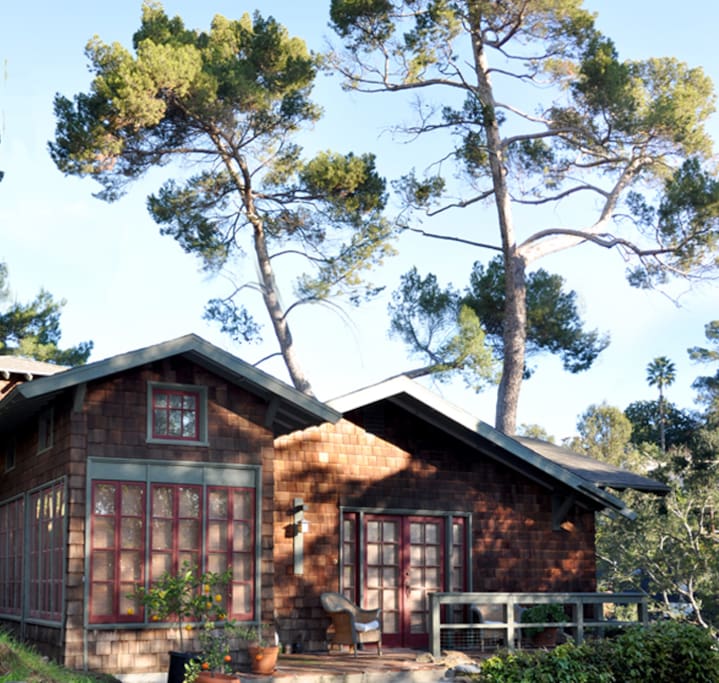 Tucked away from the street and perched on a small hill among the tree tops.