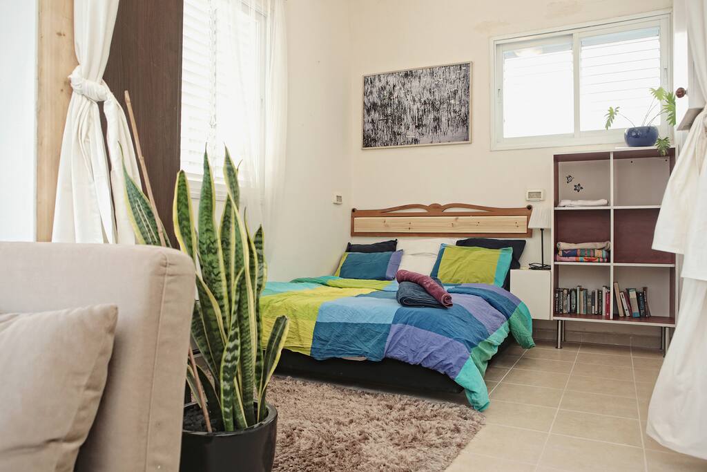 Curtains can now divide the bedroom from the living room to give privacy