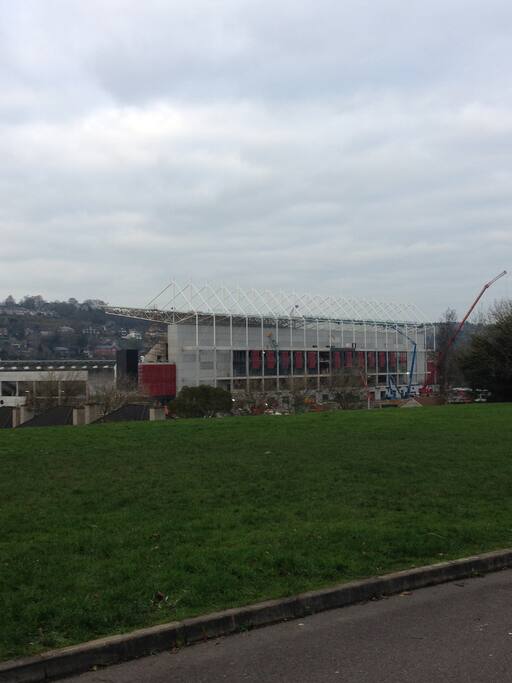 Overlooking a green and the stadium