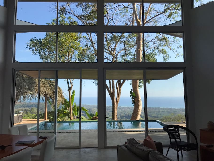 High ceilings and glass windows provide an extraordinary view from the living room