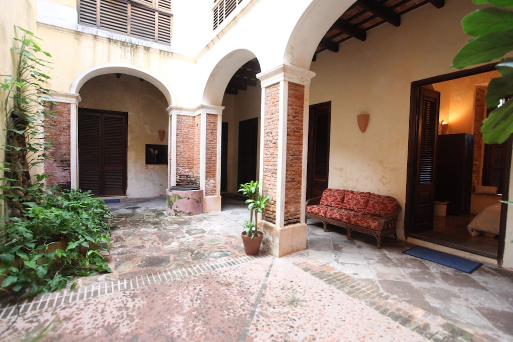 Three bedrooms with plush linens open into the restful courtyard. Each room has custom moroccan tile floors, and beautiful historical touches such as marble in-room sinks, carved wood arches, exposed brick and handmade sconces.