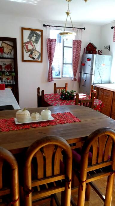 Full kitchen with breakfast bar, refrigerator, and 6 burner stove.