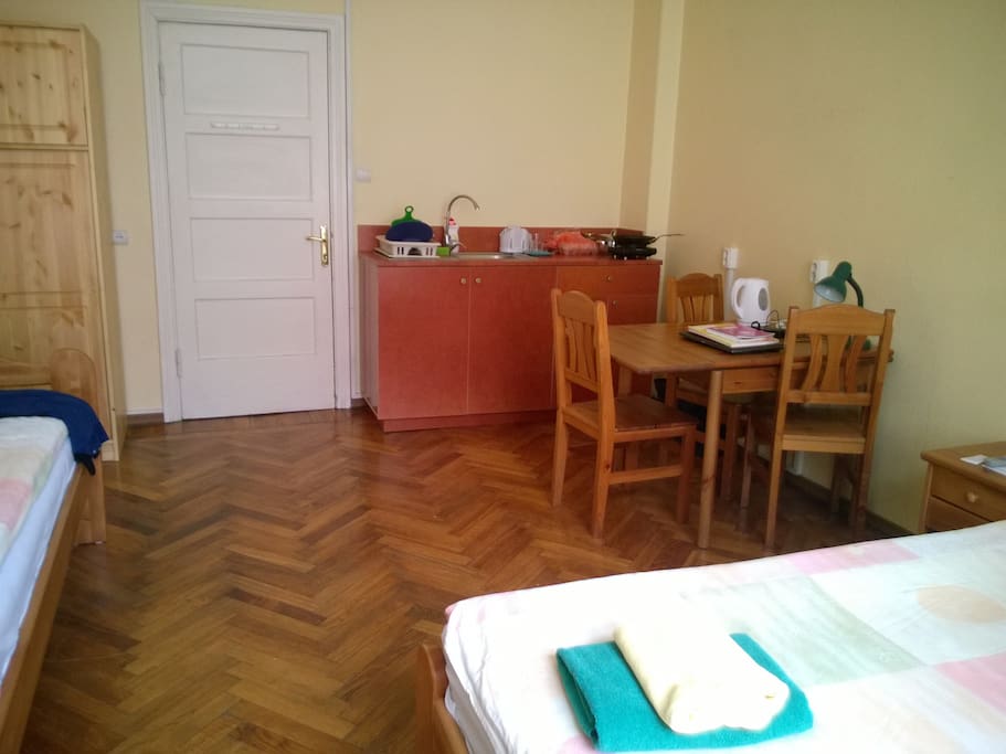 Studio room with one single bed and one Double bed