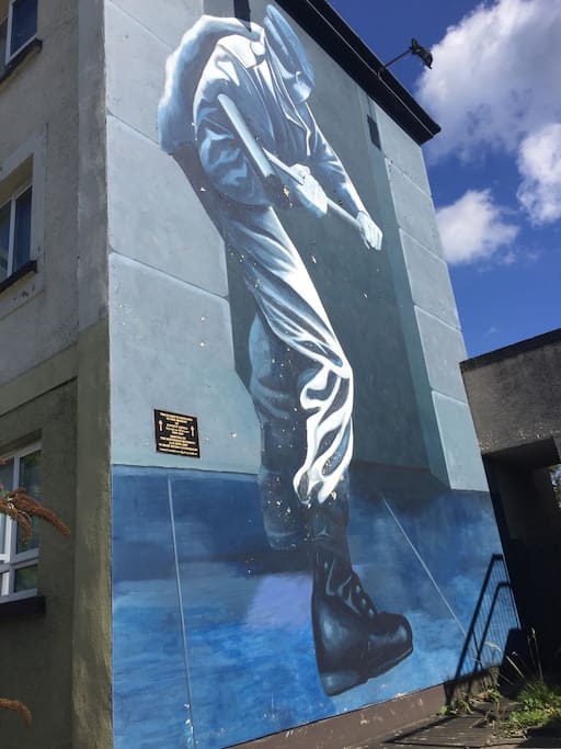 On the side of the wall.
You can't get any closer to the historic murals than to stay in a property that plays host to one of them.