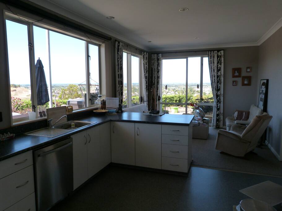 Shared kitchen and sitting room with views over Napier to Mahia Peninsula