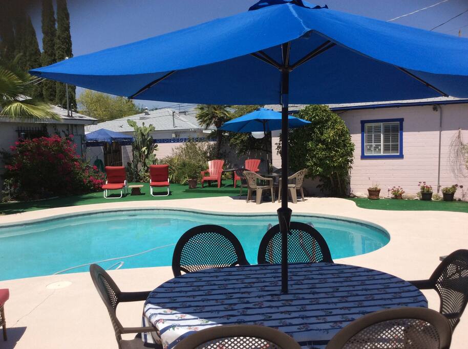Poolside seating next to barbecue