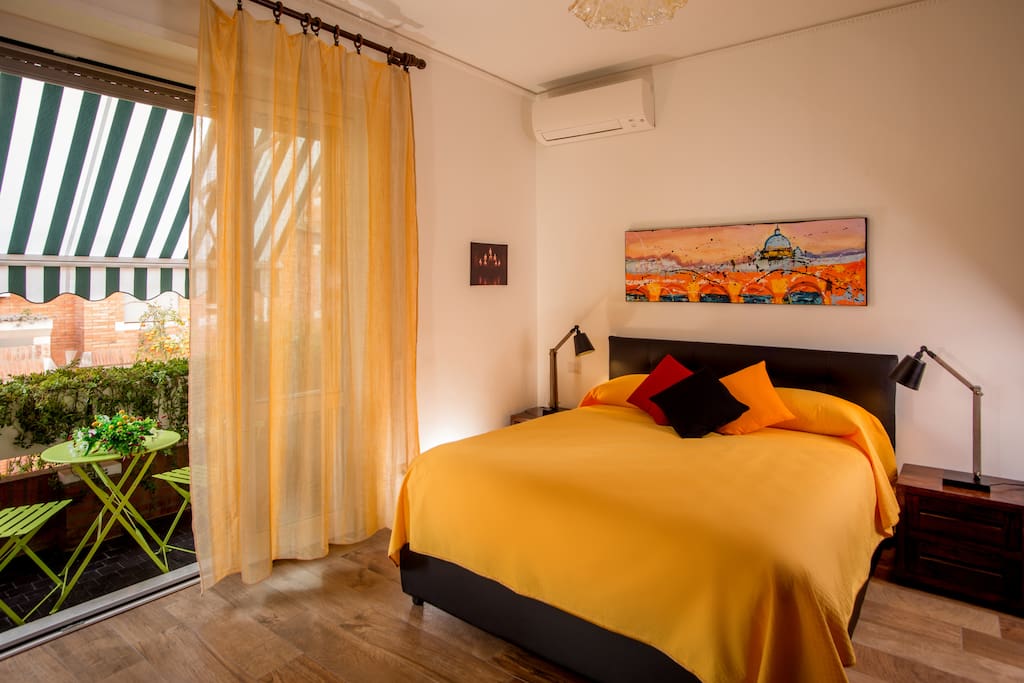 Bedroom with air conditioned, big door window and awnings