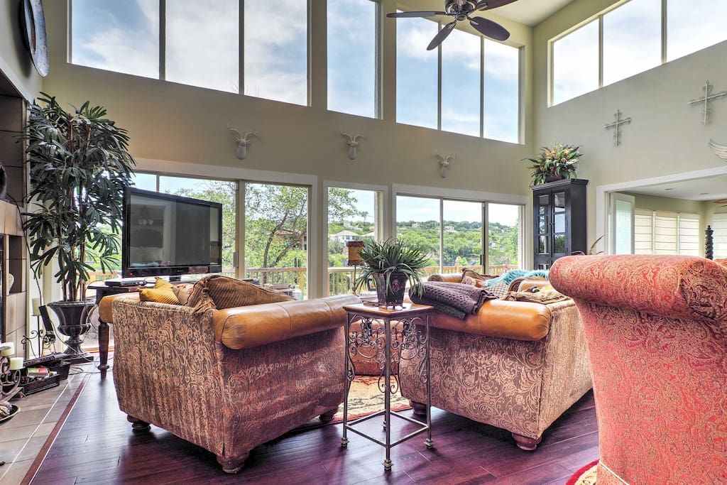 Expansive windows lend magnificent lake views throughout the home.