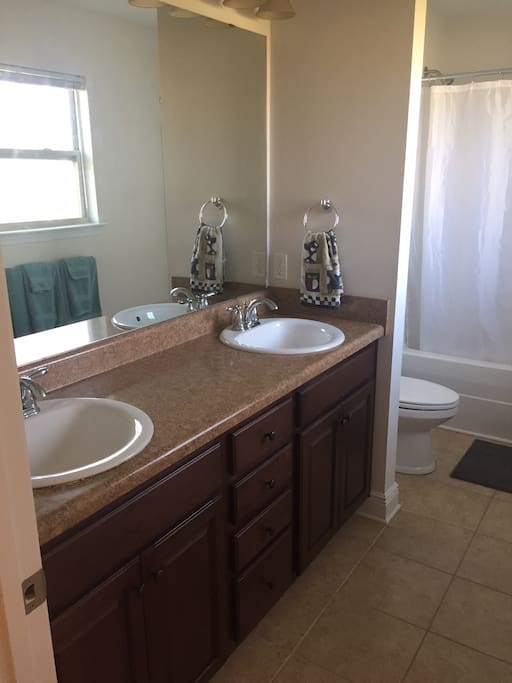 Clean bathroom. Shower/tub. Double sinks.