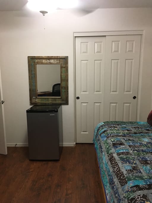 Large mini fridge to store your goodies, along with a full closet to hang and store more of your "stuff"