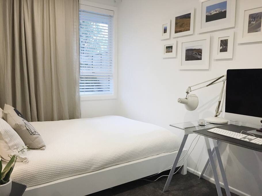 guest room is small but perfectly formed: queen bed, desk and wardrobe