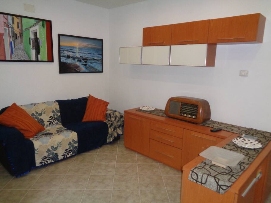 Living room with TV, Sofa.