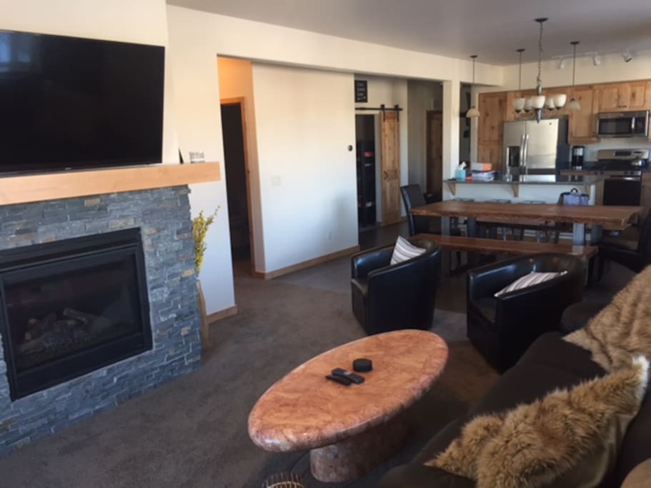 Open Living Space with seating for 8 at the table, plus 4 bar stools. Queen sleeper sofa is also available.