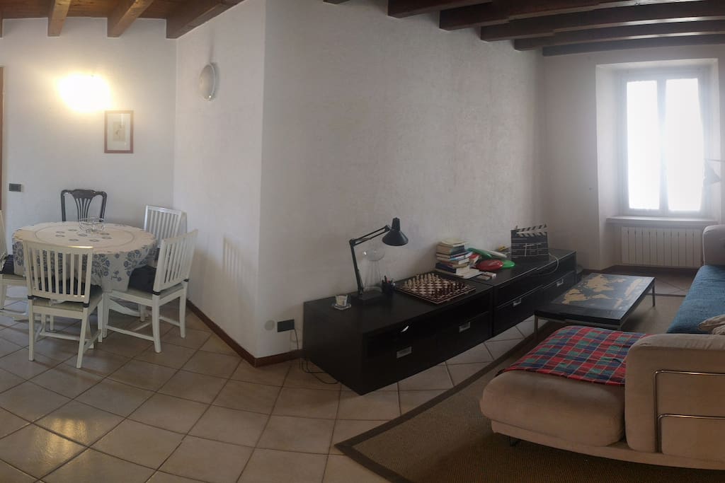 This is my living room: a big dining table and a comfortable couch.