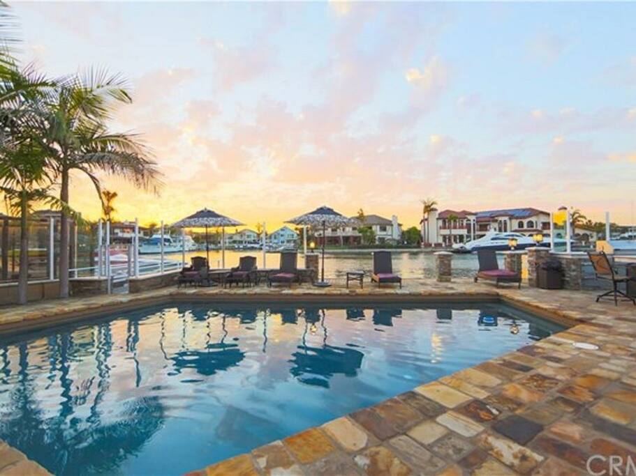 Luxurious pool area for relaxing with water views.