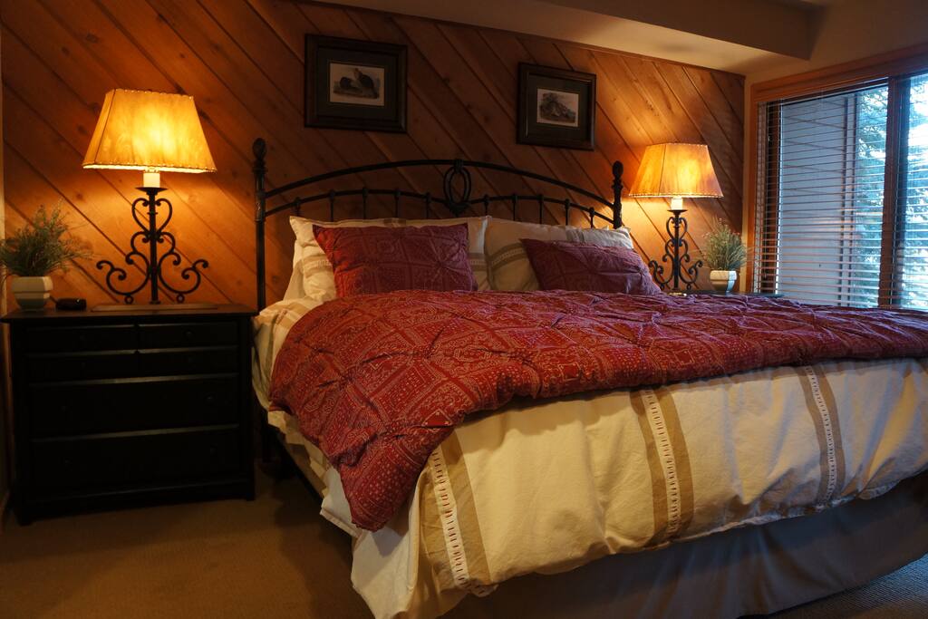 The king bed in the master suite with walkout patio provides plenty of space to spread out and plenty of comfort to get cozy