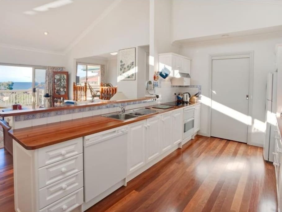 Large open plan kitchen with ocean views