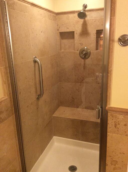 Walk-in shower, all toiletries provided such as shampoo.