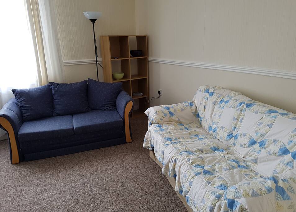 Bright comfortable front room with two sofas