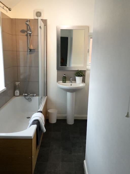 Bathroom with shower over the bath.
There is also and extra toilet downstairs as well as upstairs.