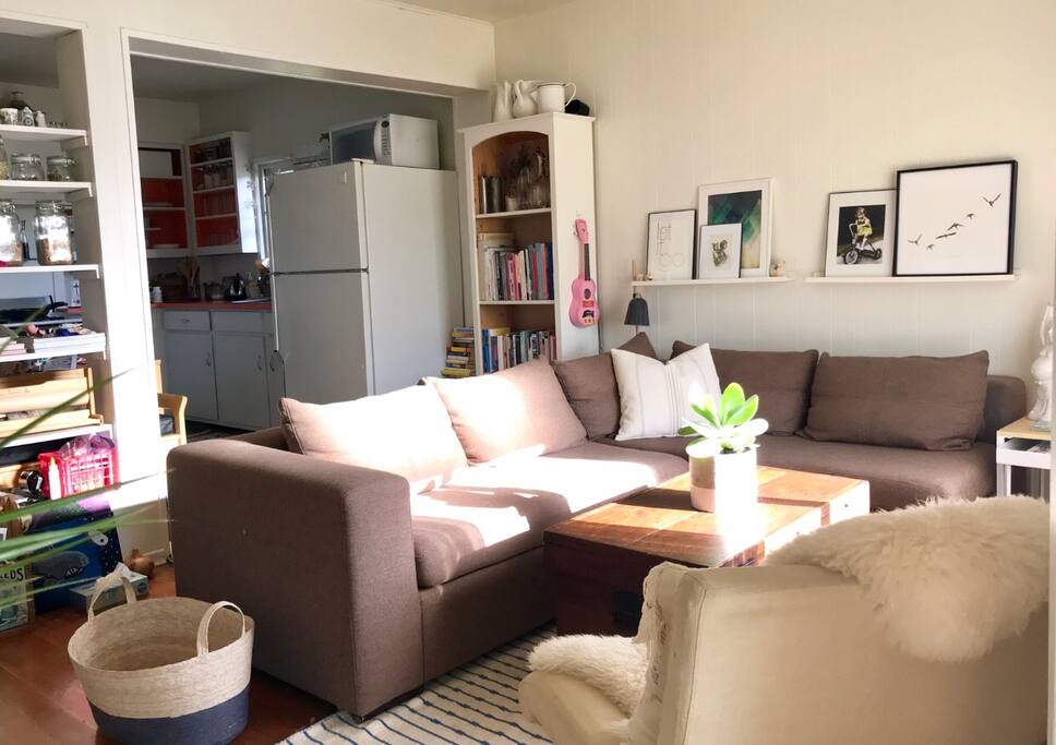 Mornjng sun coming they the living room. Open kitchen, living room with access to the sunroom/office.