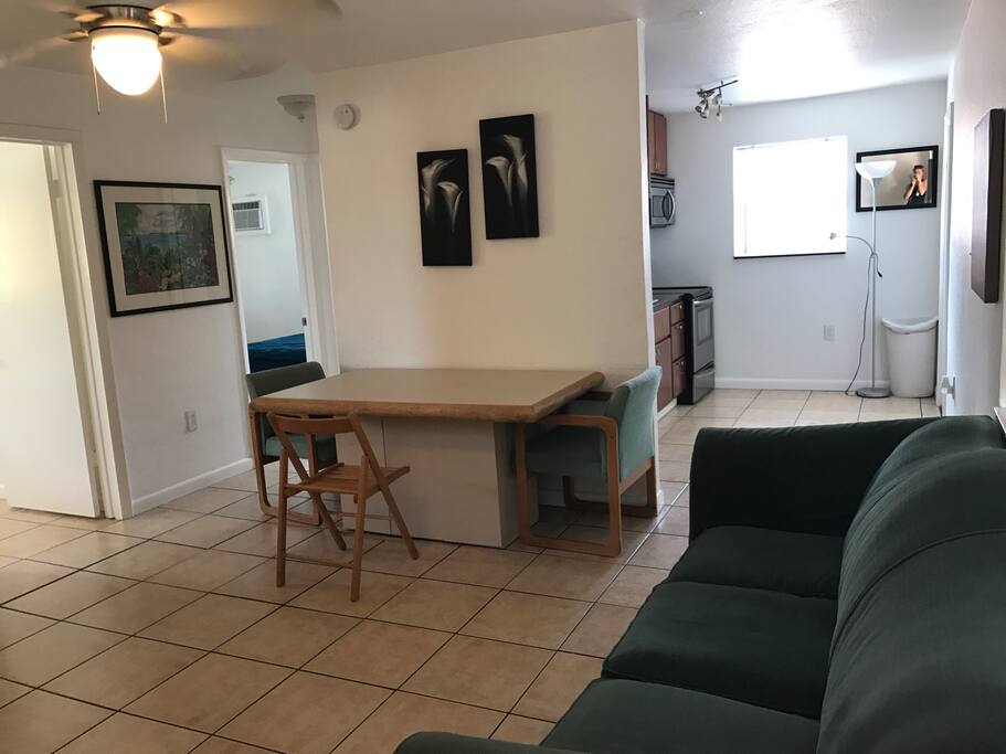 Dining table, comfortable couch.