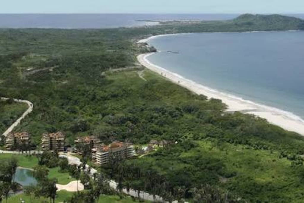 Located by a mangrove swamp, access to the beach by the eighteen hole's green .