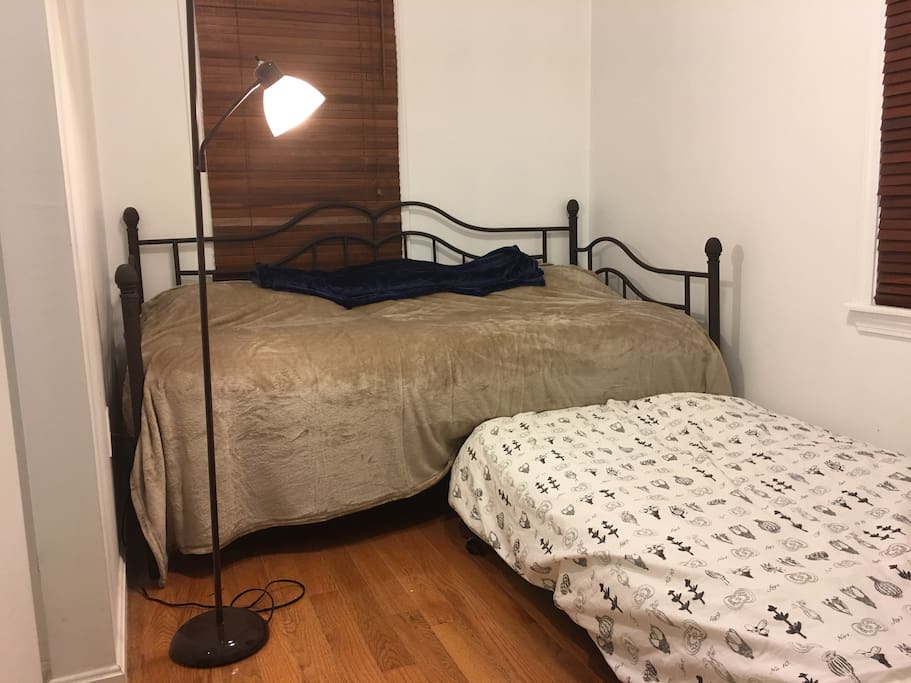 Another twin bed is hidden under the daybed and it is easy to pull out for setting up.