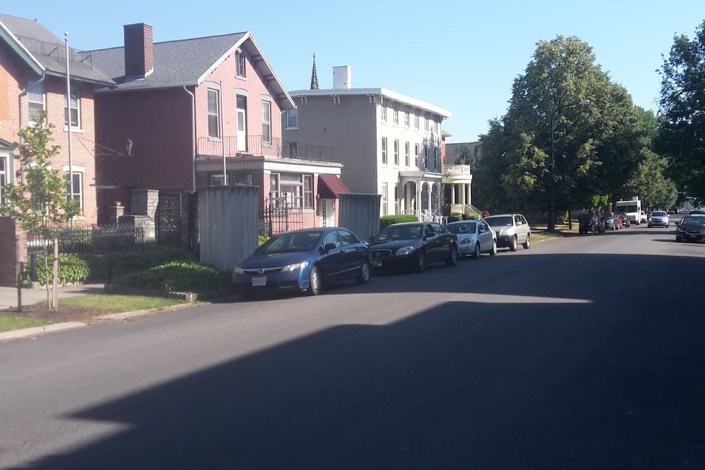 The building you'll be staying in is to the far left. Parking is available on both sides of this relatively quiet street, for free. There is no limit to how long your car stays here.