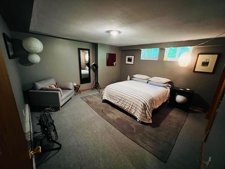 Large master bedroom with queen size comfy bed and a closet stocked with fresh towels and extra linens. Also a large fan, space heater, suitcase tray, dehumidifier, an iron and plenty of hangers. 