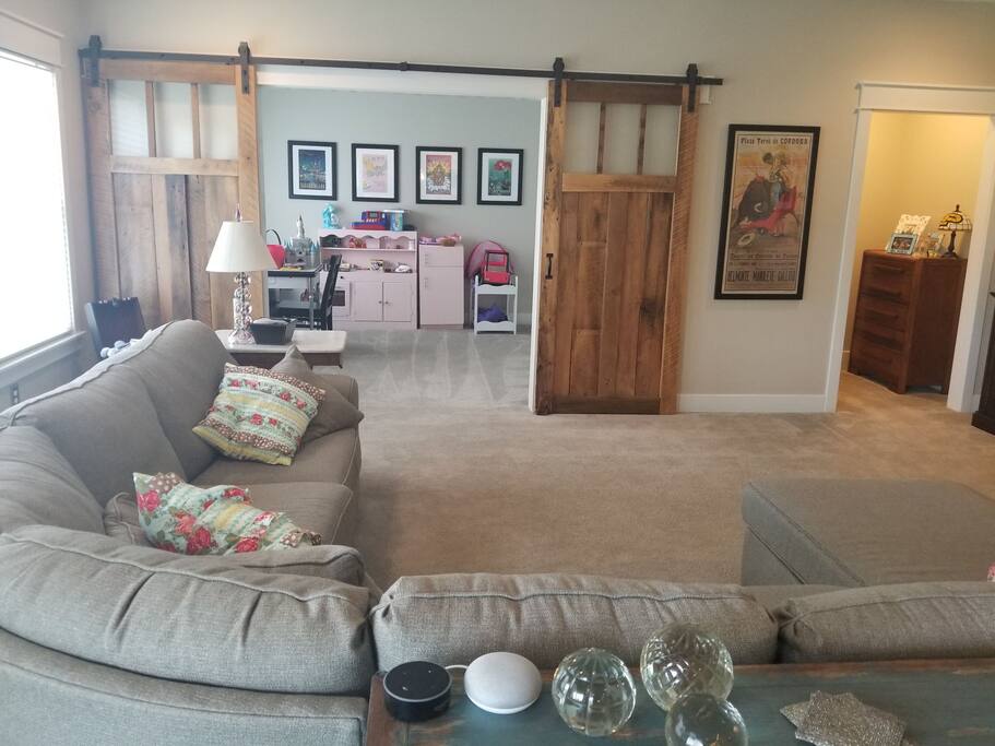 Family room and play room. sectional can sleep 2. Room for blow up mattresses. Half bath off side.