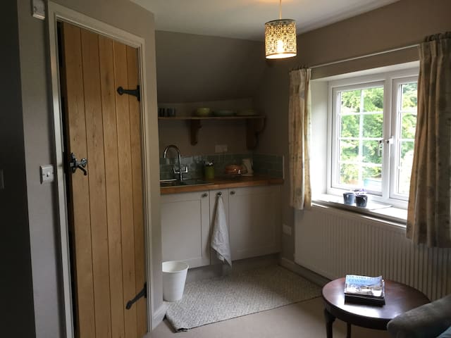 Luxury farmhouse attic suite with bijou kitchen