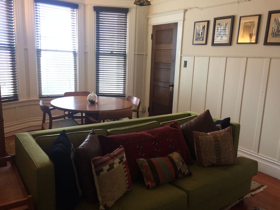 The living room - dining room has a large flat-screen TV tucked inside a built-in cabinet.
