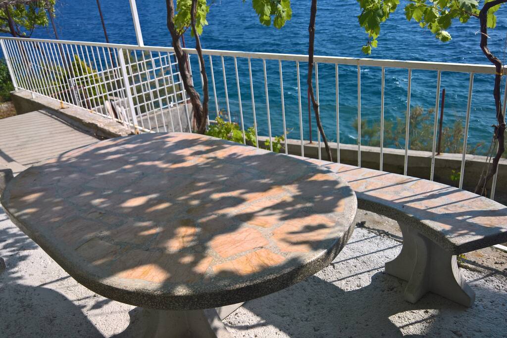 the terrace with the stairs leading to the beach
