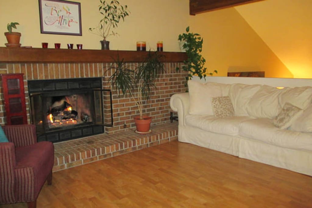 Upstairs living room big cozy couch & fireplace