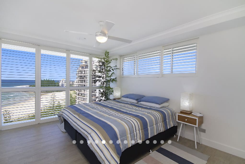Amazing beach view from the master bedroom with new King size pillow-top mattress bed for ultimate comfort