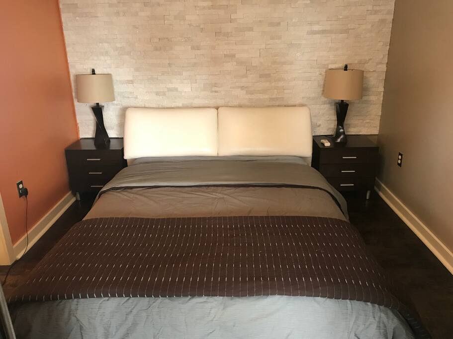 Queen bed. Room equipped with remote control ceiling fan and lighting.
