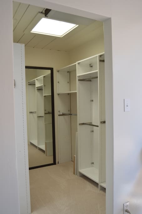 walk-in closet with skylight for natural light