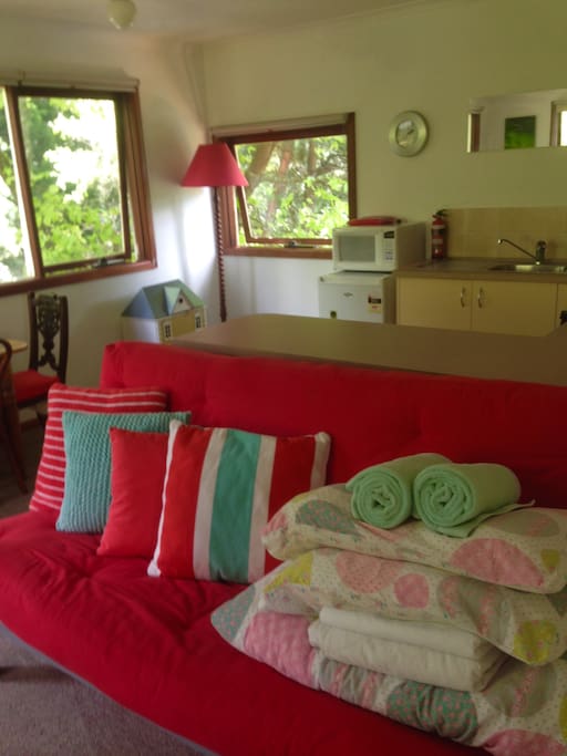 The futon couch can be converted into a double bed