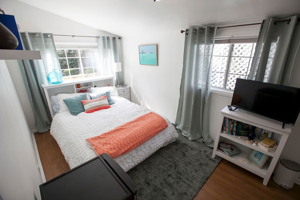 Bedroom is bright and airy. Blinds and drapes if you prefer a darker room.