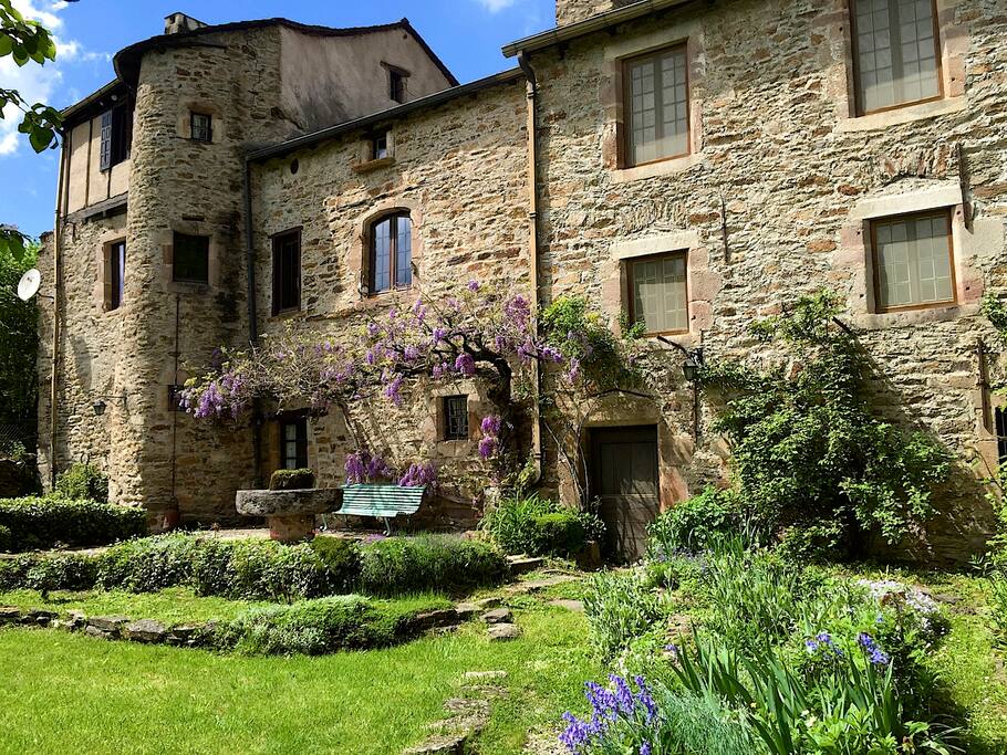 Maison Calmont, our house for rent, is to the right of the drain pipe with the solid brown door. Our house is on the left. We share the garden, but you have your privacy.