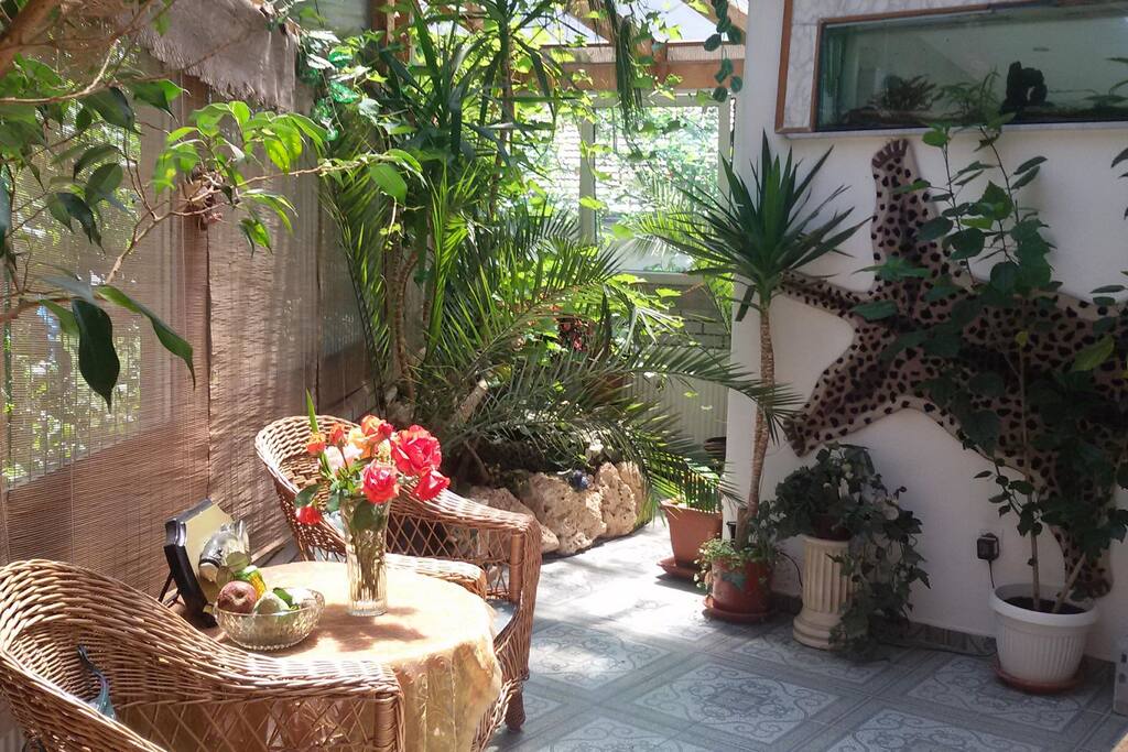 Dear guests, enjoy and relax in beautiful air conditioned glass garden room