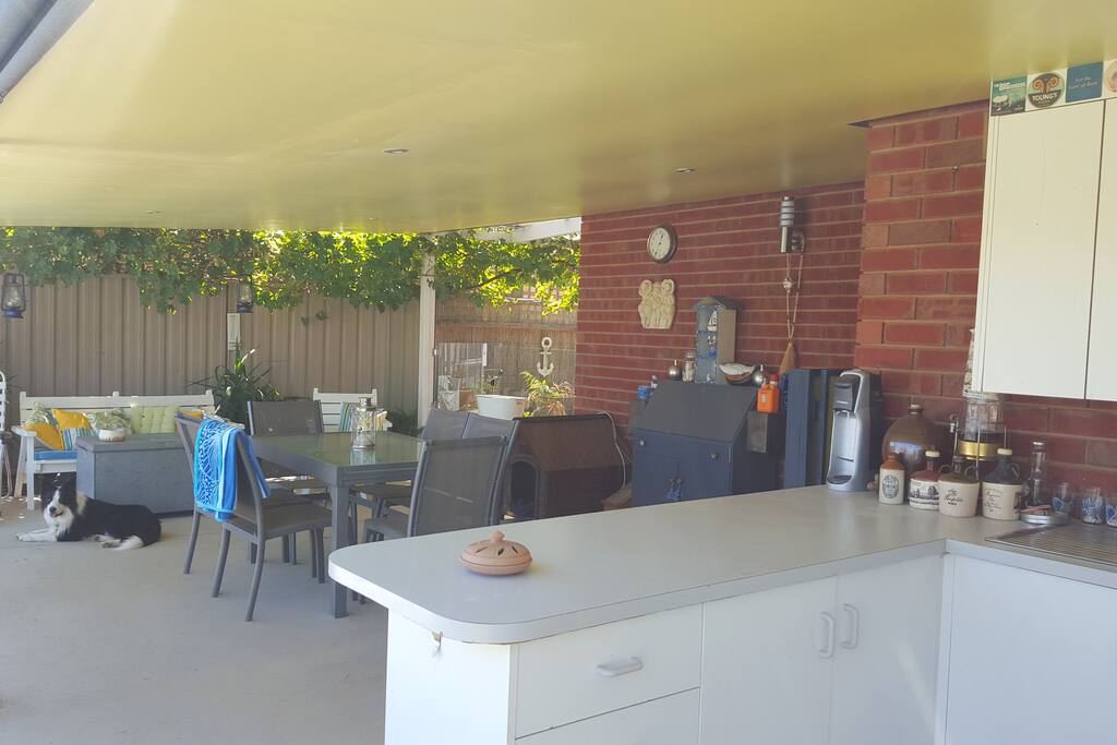Outdoor dining area from outdoor kitchen/bar