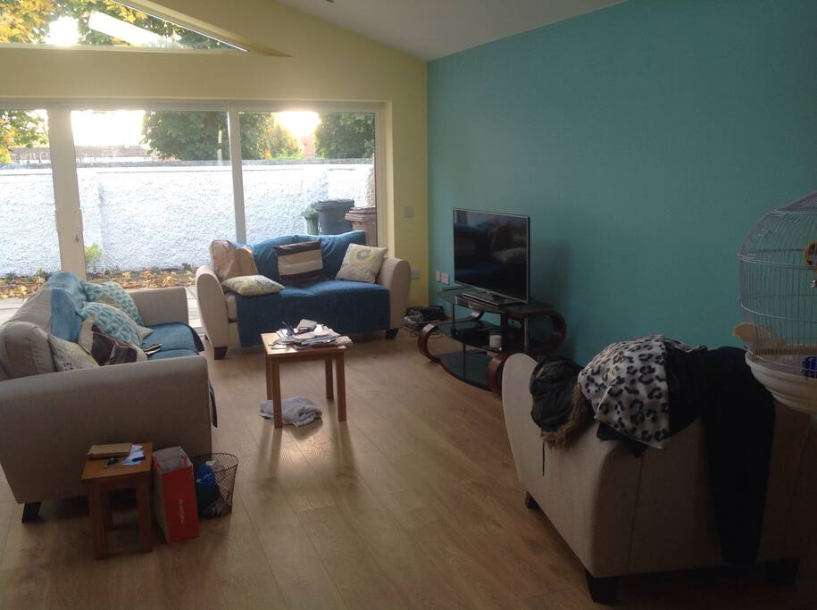 TV room which is open plan to allow for wheelchair mobility. Kitchen area is behind me taking photo