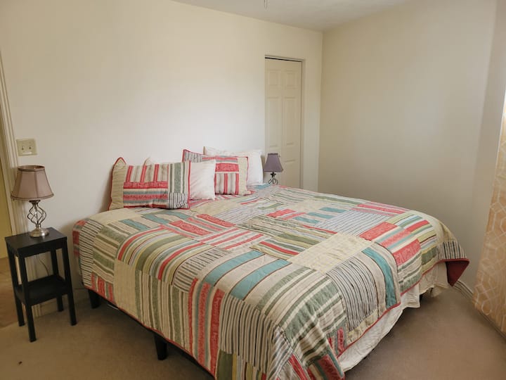 Downstairs room with Sleep Number king bed.