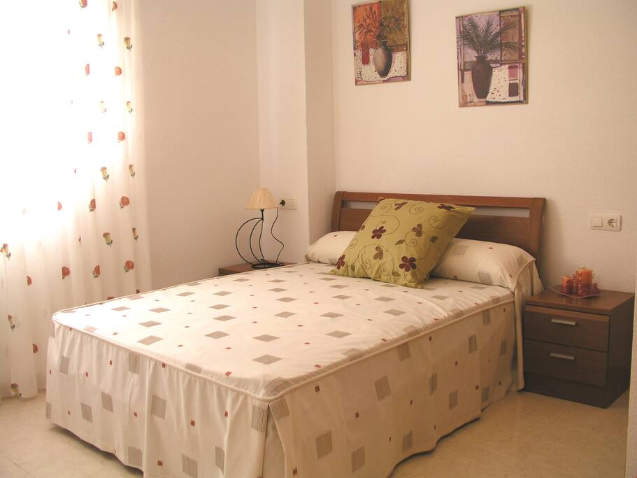 There's a double bed in the main bedroom.