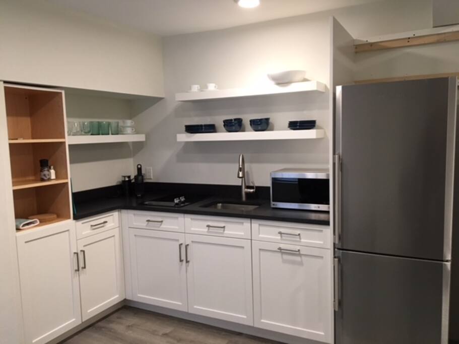 Kitchen awaiting last cabinet door!